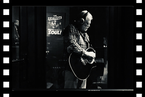 Martin playing acoustic in early session